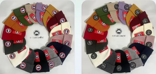 Knitted beanies fanned out in a ring of many colours