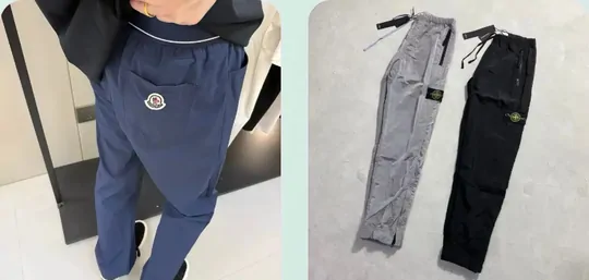 Navy track pants worn on a model beside grey and black cargo joggers