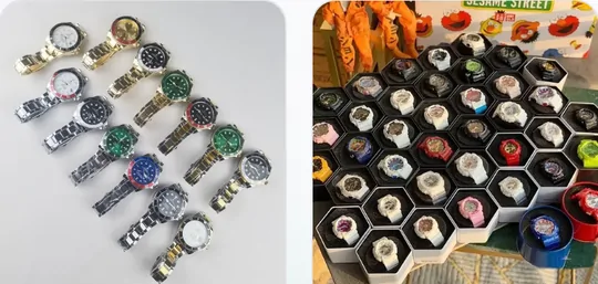 Steel bracelet watches with coloured dials laid out on a white surface
